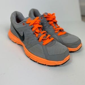 Gray and neon orange Nike’s size 9.5